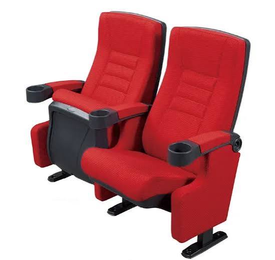Red cinema chairs with molded cup holders