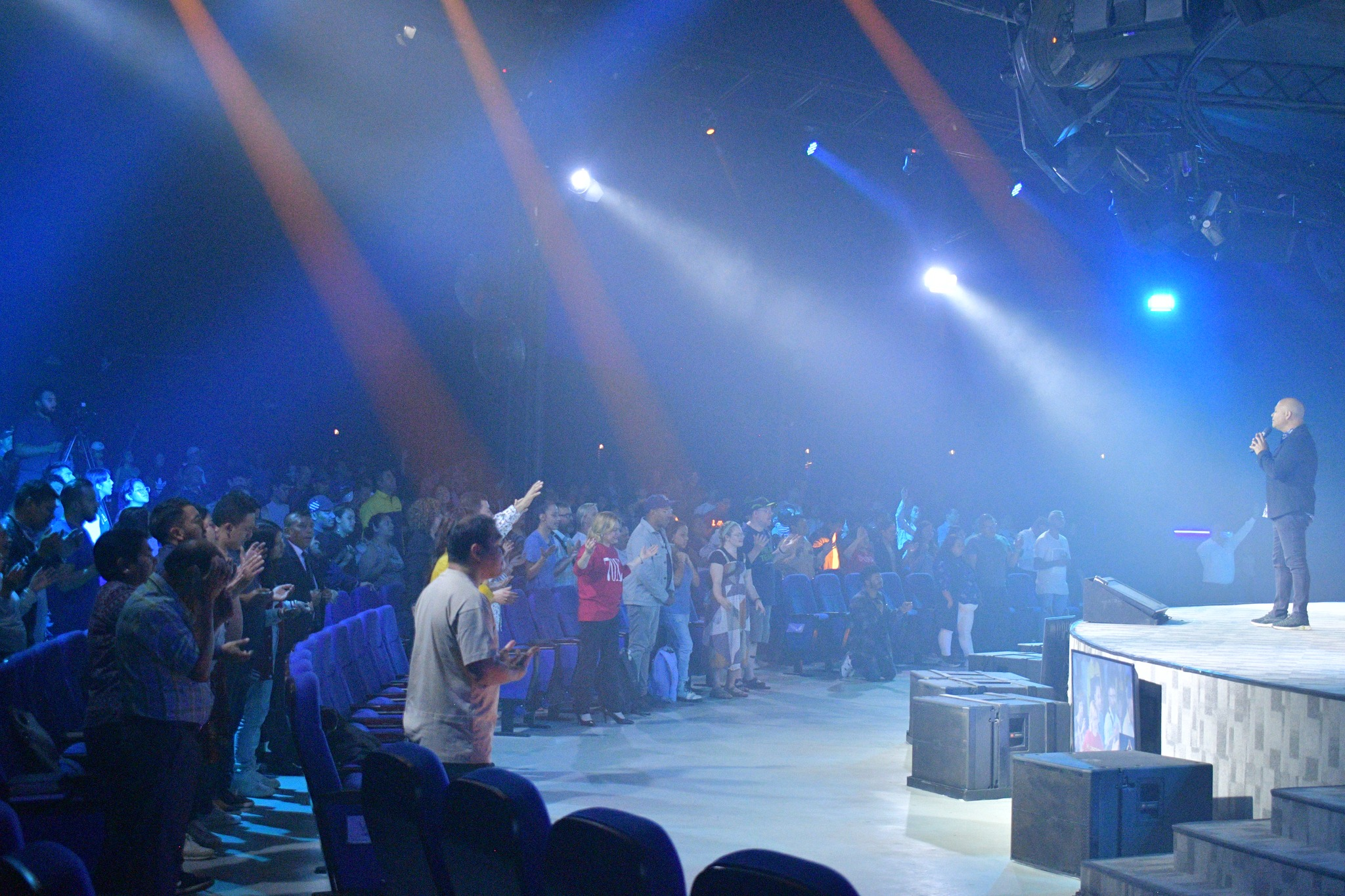 Large audience gathered in an auditorium during a live event
