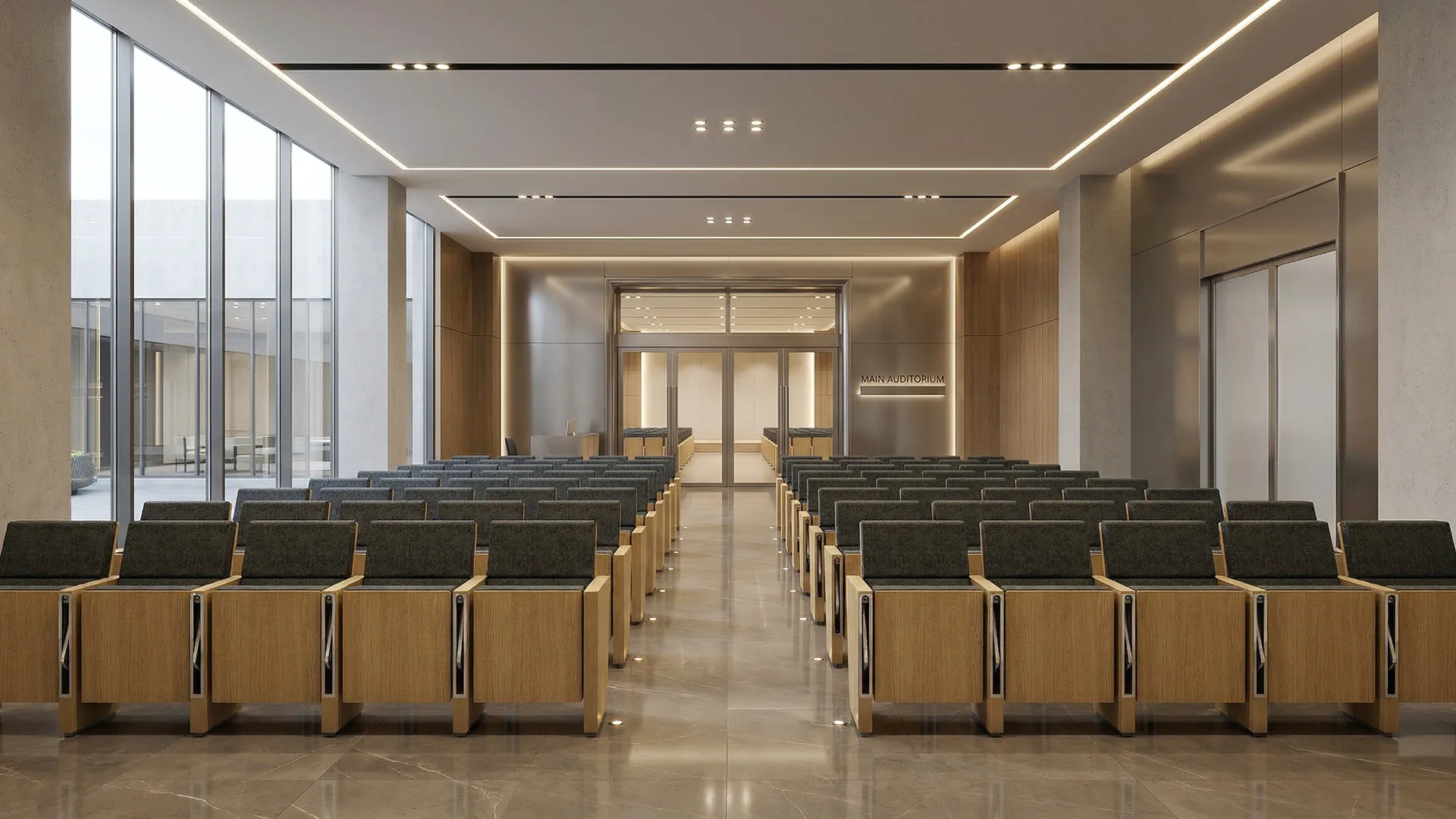 Warm-toned auditorium fitted with rows of project seating